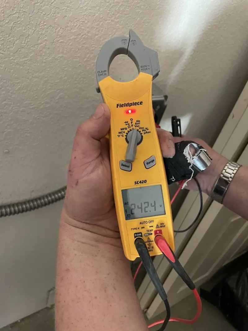 Voltage testing with clamp meter during Generator Installation in Hartsville-Trousdale County